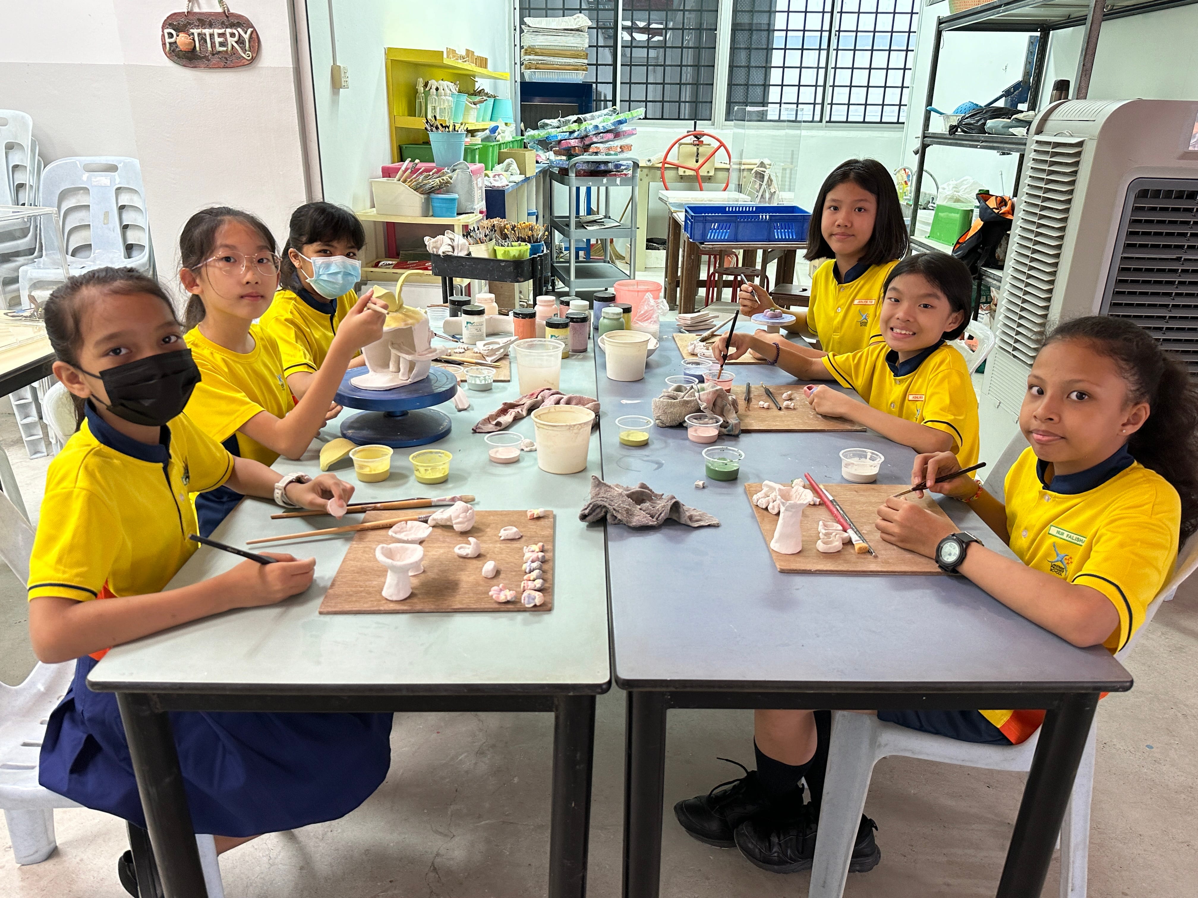 Artists of the artwork “Small Sculptures, Grand Ideas” in action